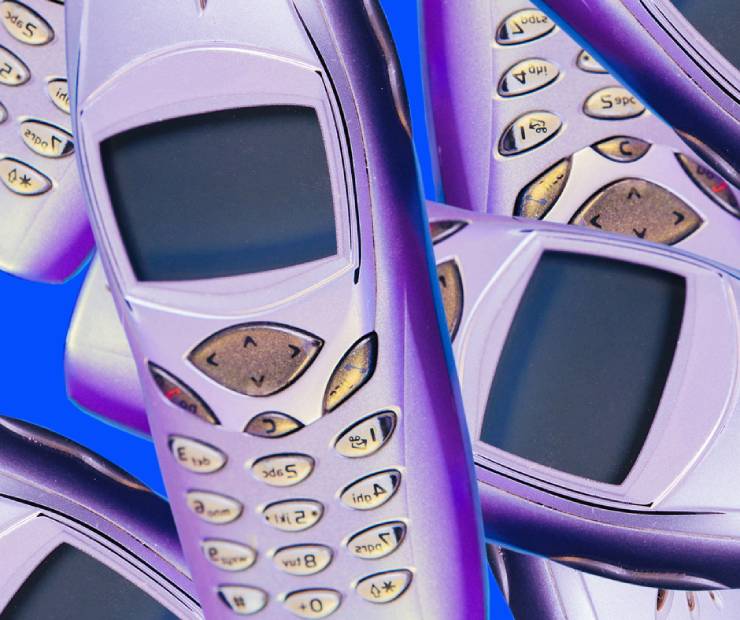 Old Nokia lookalike cell phones, tinted lavender on a blue background.